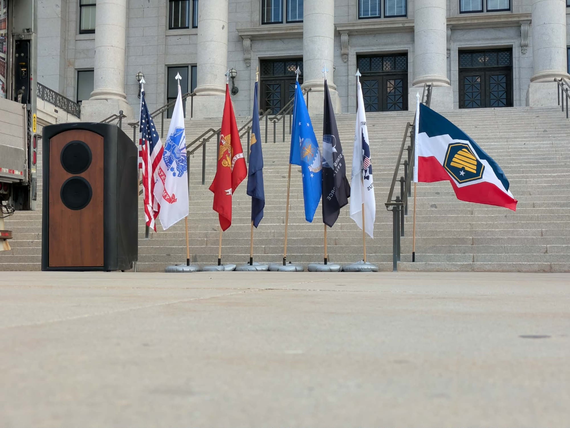 A row of service flags on the steps of the Utah State Capitol